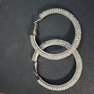 Large rhinestone metal hoop earrings (missing one rhinestone) not very seen.